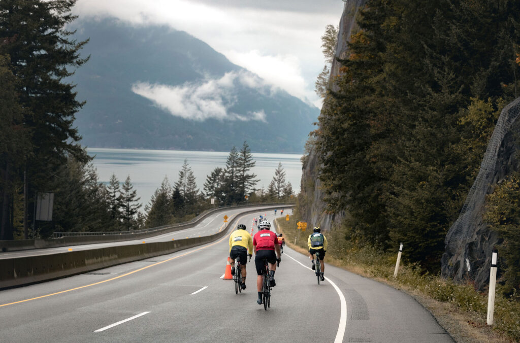Cyclists ride the Sea to Sky Highway as they race during GranFondo.