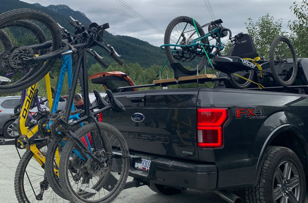 The Darnell family's bikes on the back of their trucks.