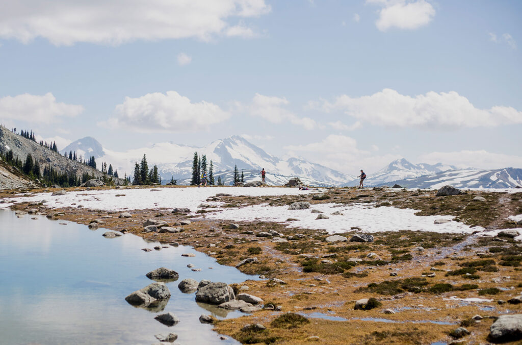 A hiker makes their way to Blackcomb Lake on Blackcomb Mountain.