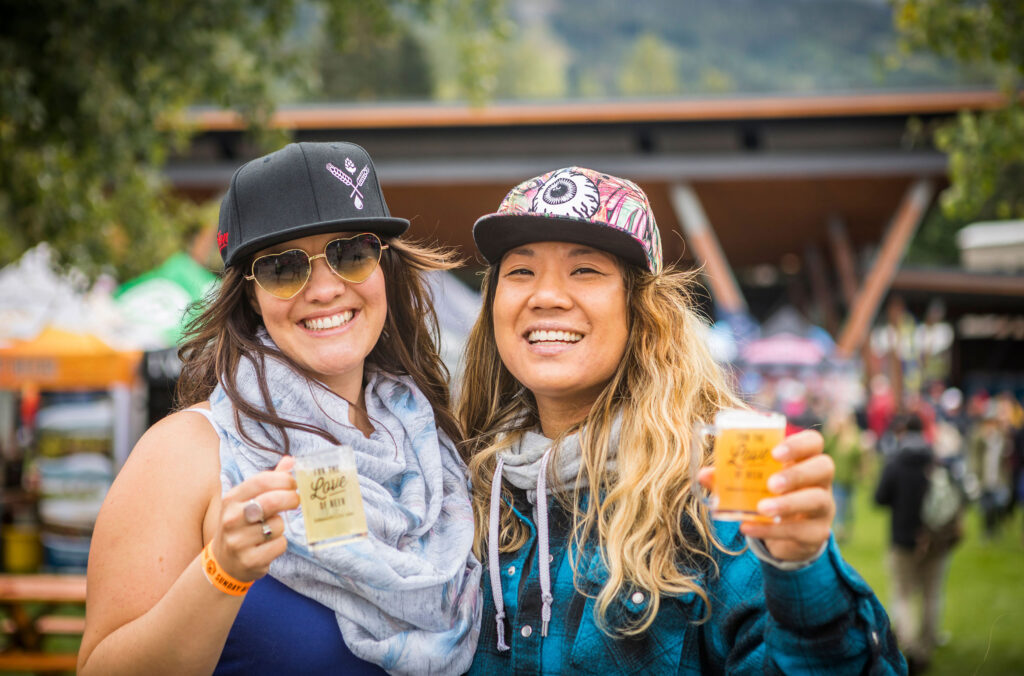 Two beer lovers says cheers at the Whistler Village Beer Festival.