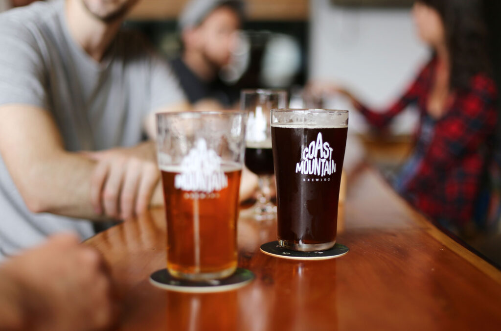 Glasses of locally crafted beer at Whistler's Coast Mountain Brewing.