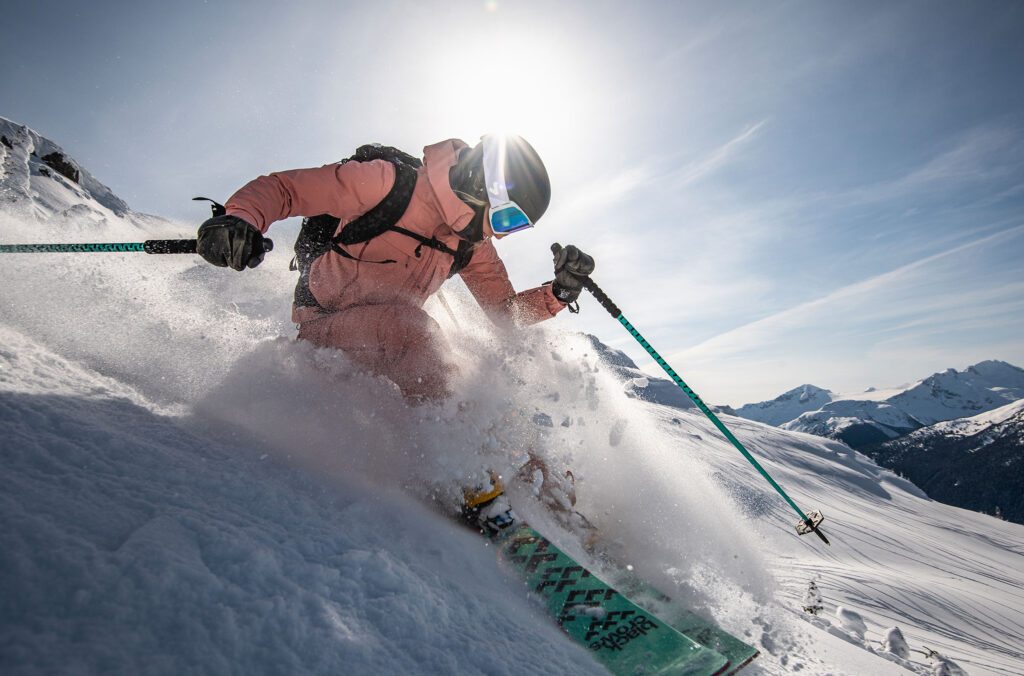 A skier powers through the snow on a run on Whistler Blackcomb.