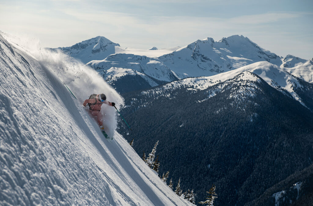 A skier powers through the snow on a run on Whistler Blackcomb.