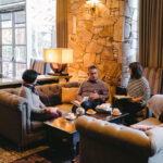 A group of people gather in the plush lobby of the Fairmont Chateau Whistler during the Whistler Writers Festival.