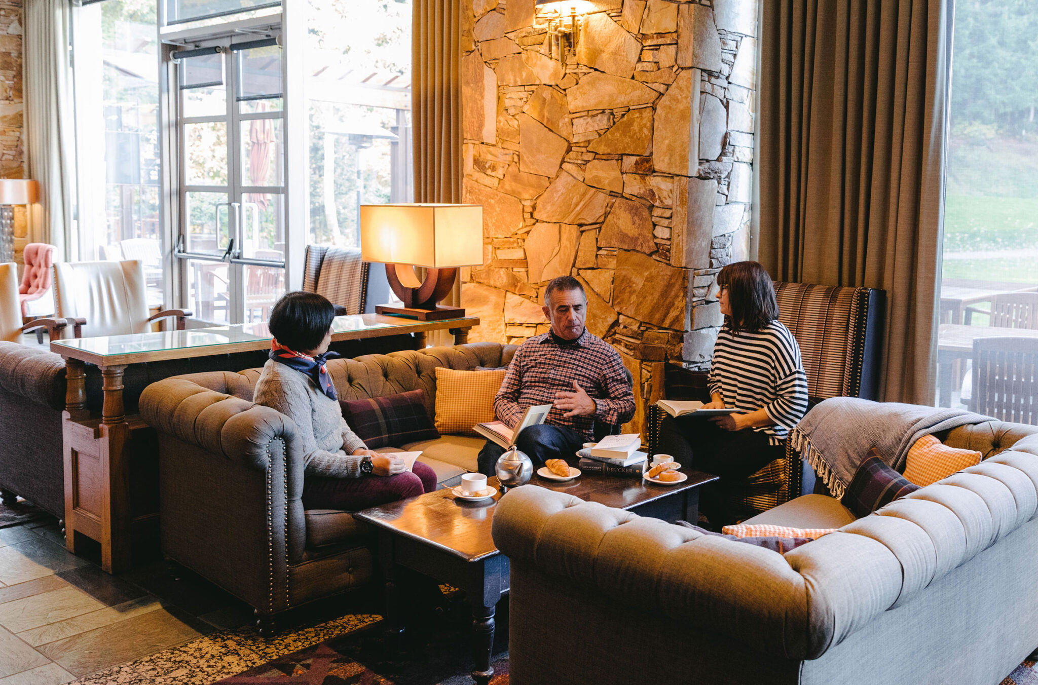 A group of people gather in the plush lobby of the Fairmont Chateau Whistler during the Whistler Writers Festival.