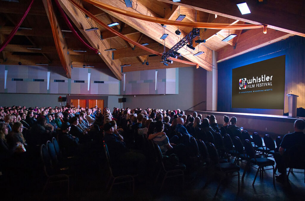 A crowd sits in the Whistler Conference Centre for a movie screening at the Whistler Film Festival.