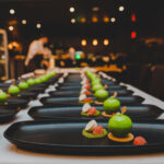 Beautifully plated food is lined up in preparation for a Cornucopia Whistler event.