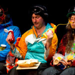 Ira Pettle squirting two fellow chairlift riders with sauce in one of his comedy performances in Whistler.
