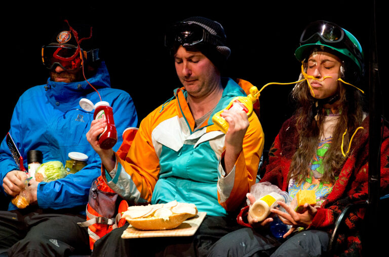 Ira Pettle squirting two fellow chairlift riders with sauce in one of his comedy performances in Whistler.