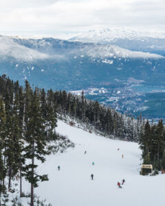 Skiers heading down the open terrain on Whistler Blackcomb's opening day.
