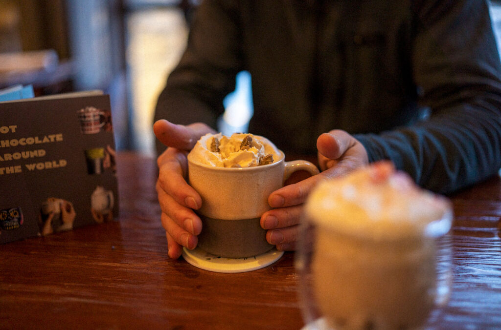 Two mugs of hot chocolate on a table at the Braidwood Tavern in Whistler.