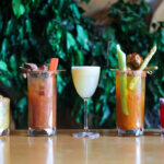 Five colourful cocktails in a row at Nita Lake Lodge.