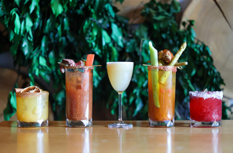 Five colourful cocktails in a row at Nita Lake Lodge.