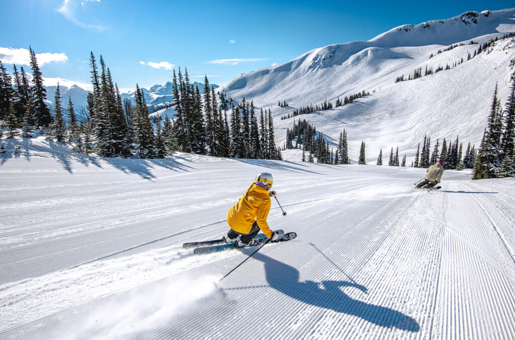 A skier enjoys a corduroy run on Whistler Blackcomb.