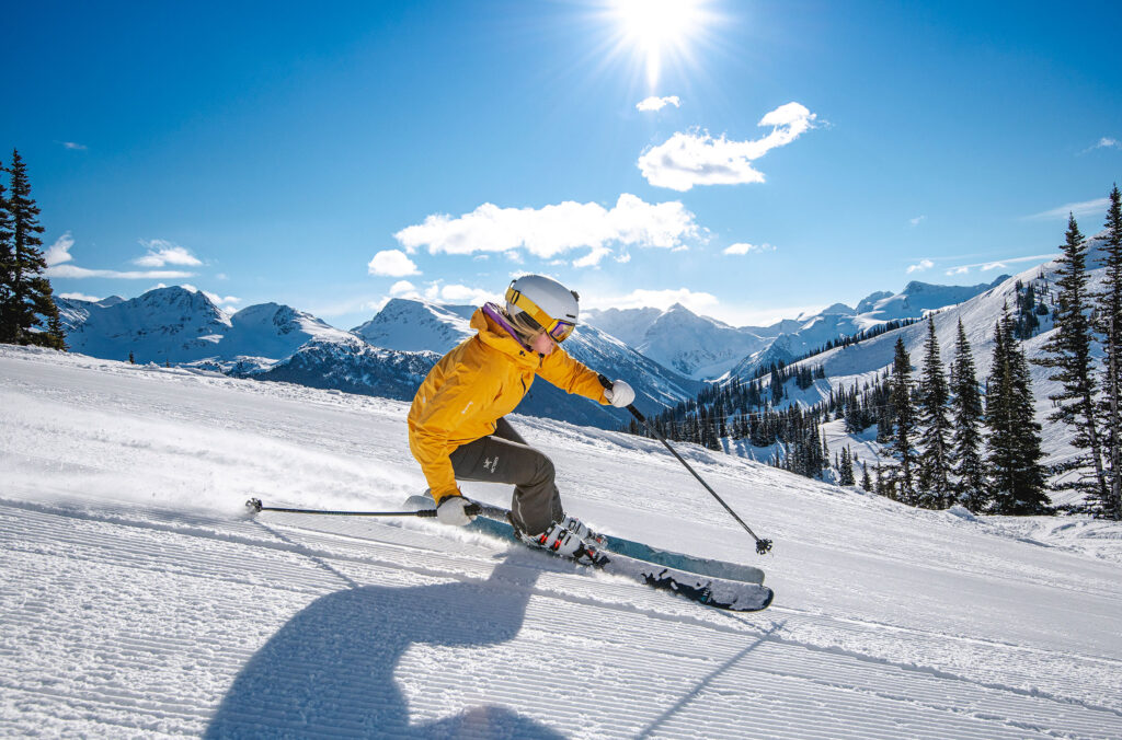 A skier enjoys a corduroy run on Whistler Blackcomb.