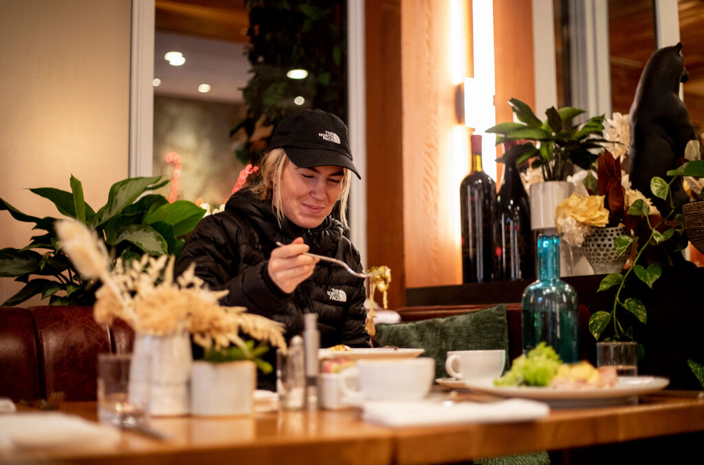 Ski athlete, Tonje Kvivik tucks into brunch at The Den at Nita Lake Lodge.