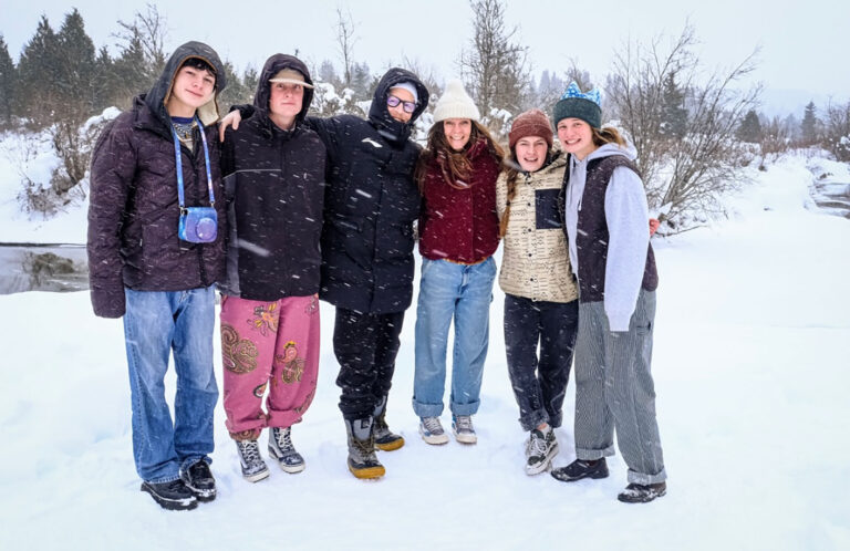 The Smith Family pose together in the snow.