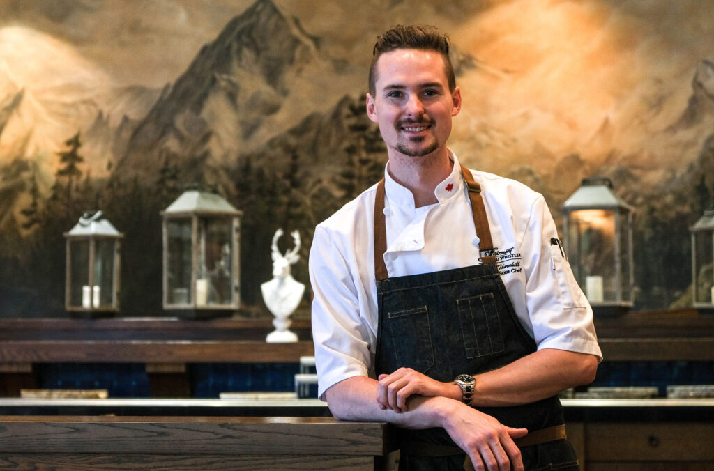 Chef Sean Thornhill leans on the bar at Fairmont Chateau Whistler.