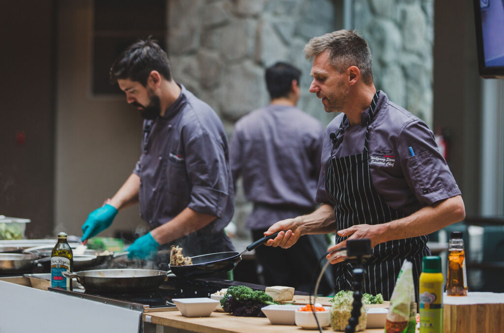 A chef shares his tips at a cooking demonstration at Cornucopia in Whistler.