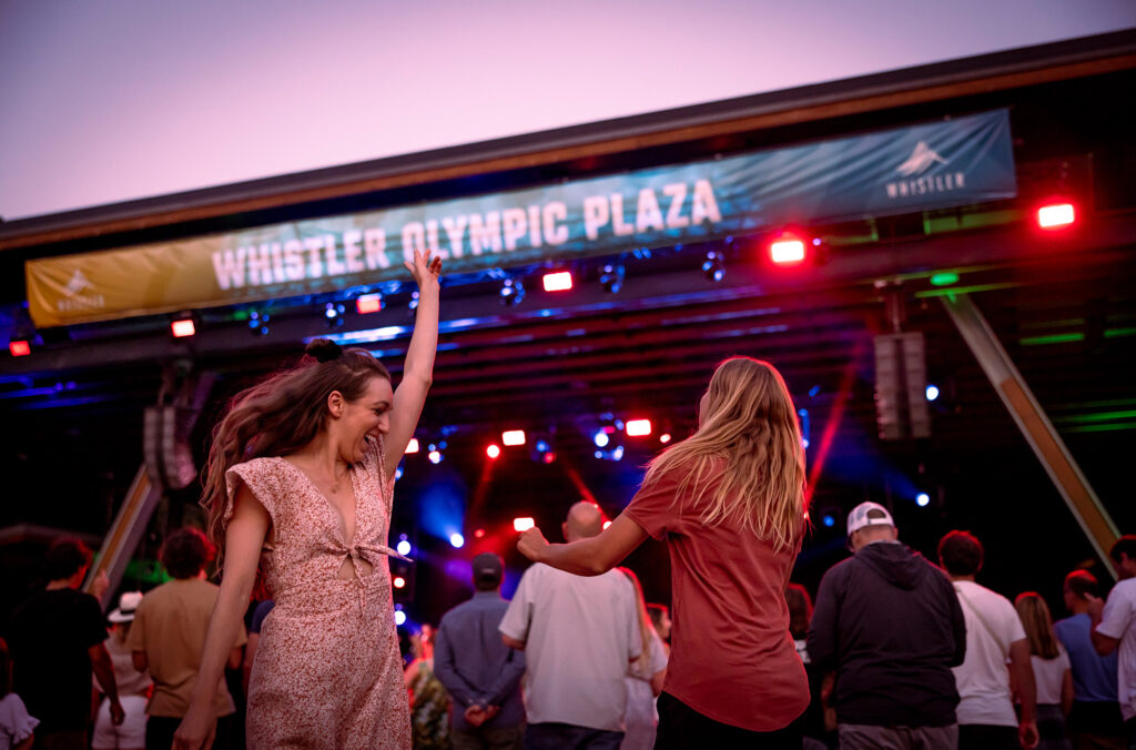 People dance in the alpenglow at the Whistler Summer Concert Series.