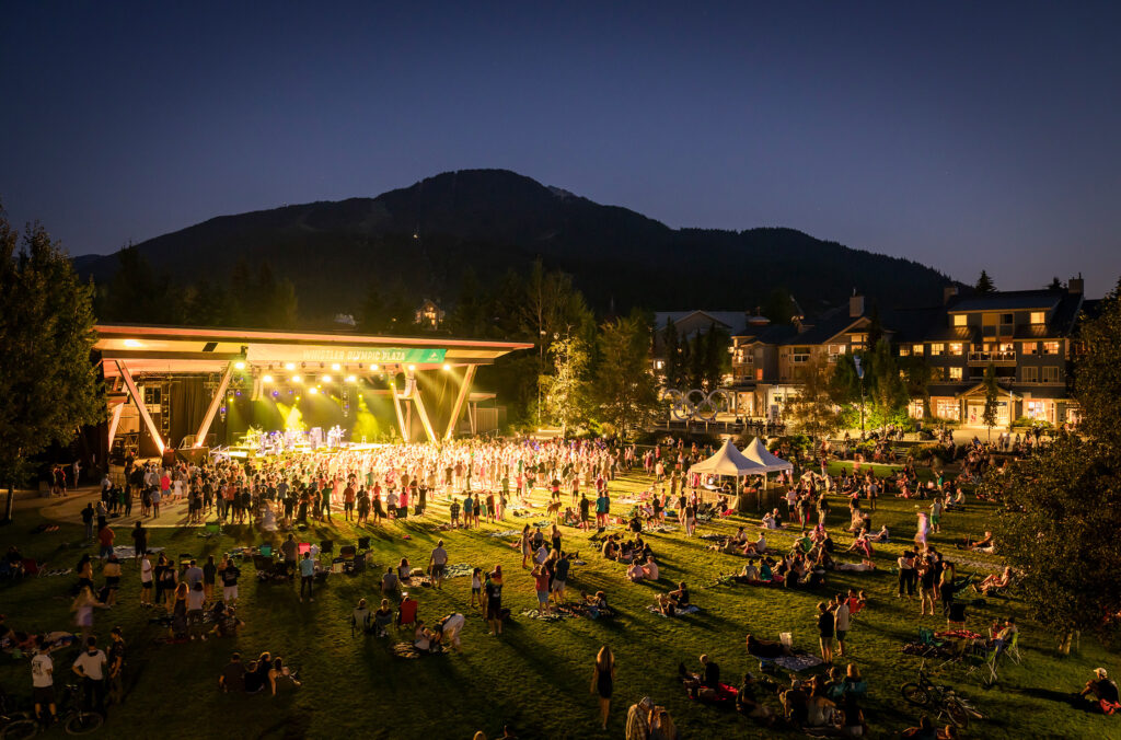 The Whistler Olympic Plaza lit up in the night by the Whistler Summer Concert Series.