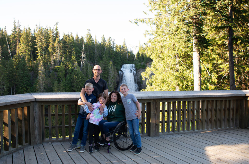 Codi Darnell and her family pose for the camera on the Alexander Falls lookout in Whistler in the summer.