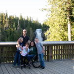 Codi Darnell and her family pose for the camera on the Alexander Falls lookout in Whistler in the summer.