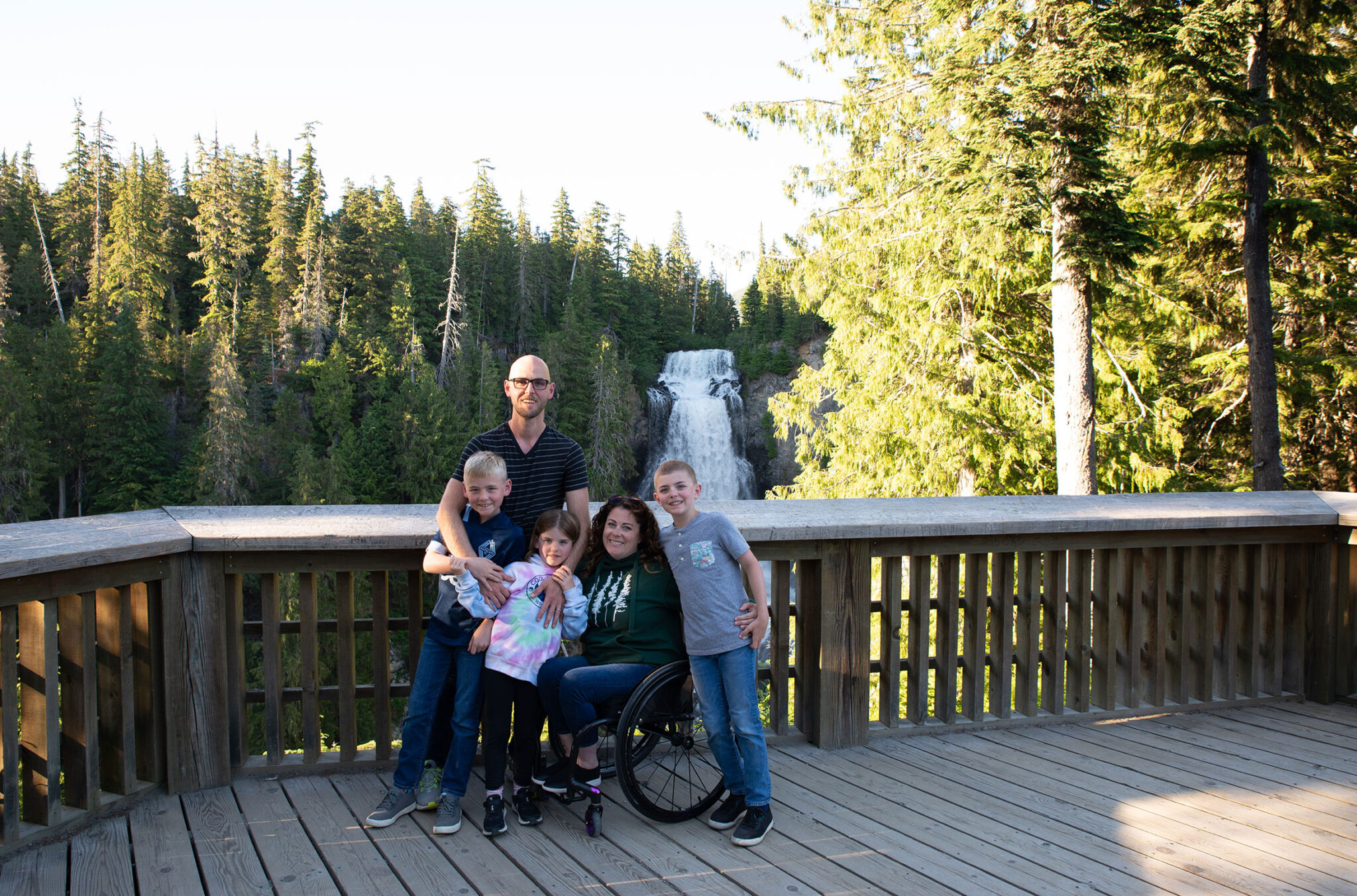 Codi Darnell and her family pose for the camera on the Alexander Falls lookout in Whistler in the summer.