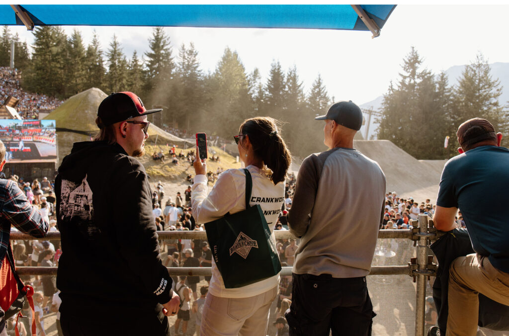 Three people enjoy epic views at Crankworx Whistler with a VIP pass.