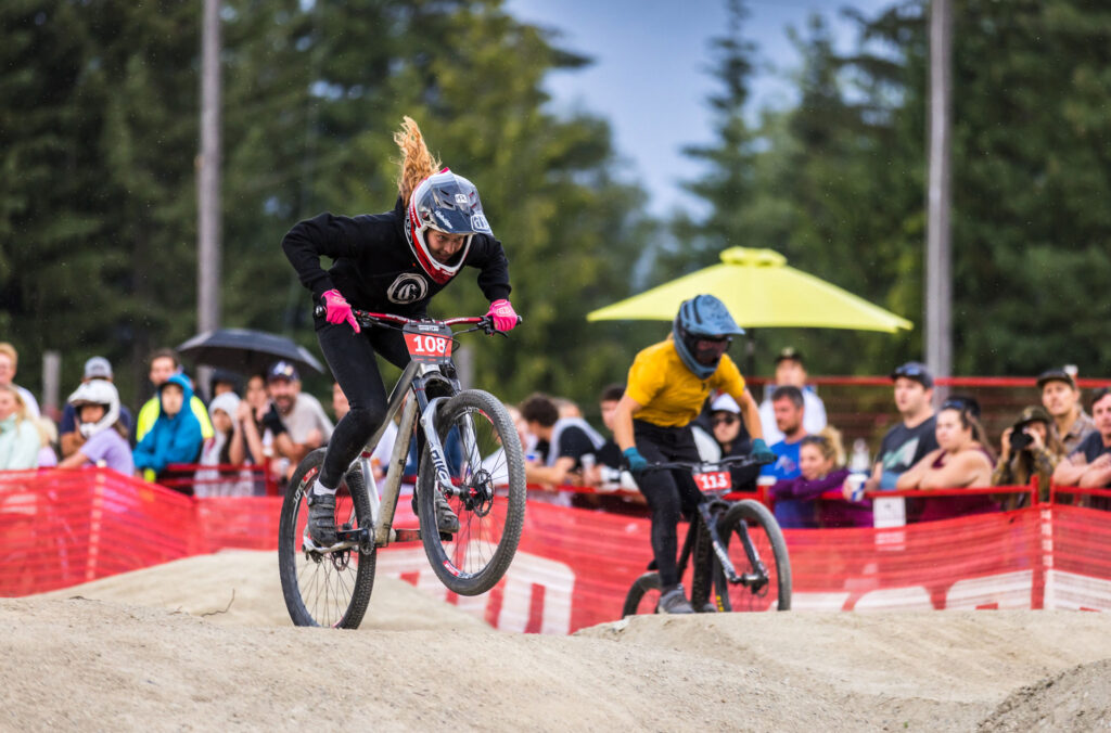 Two bike athletes compete during the Pump Track event at Crankworx Whistler.