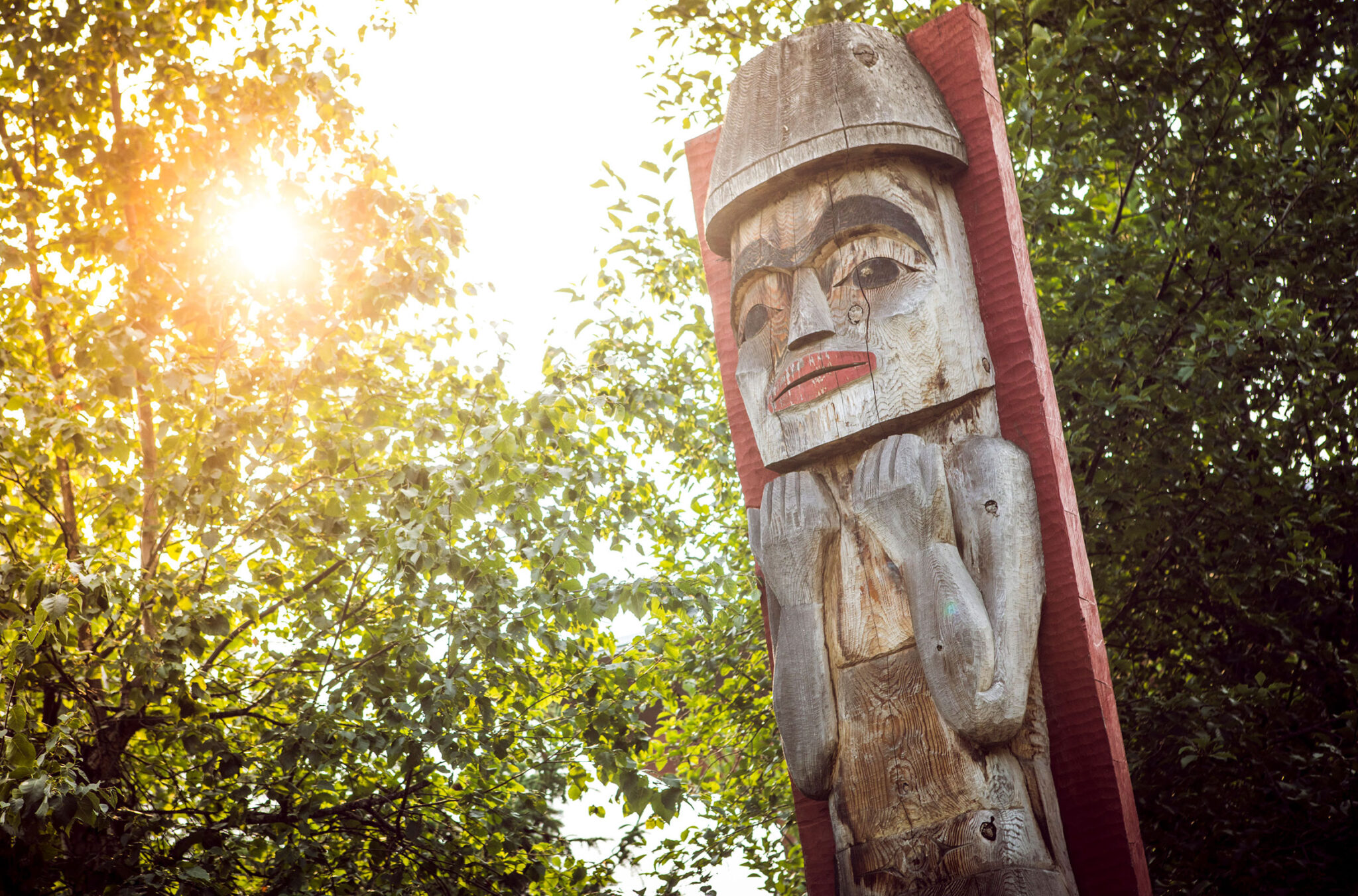 A photo of the Welcome Pole at the front entrance of the Squamish Lil'wat Cultural Centre in Whistler.