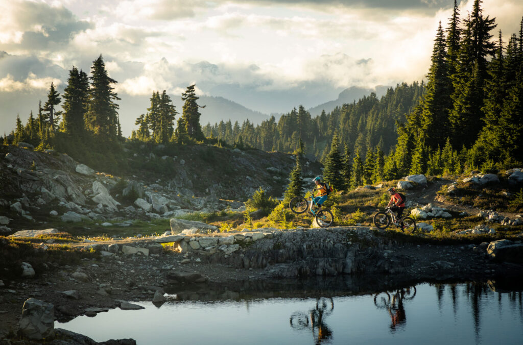 Two mountain bike riders pedal in the high alpine on Sproatt Mountain in Whistler.