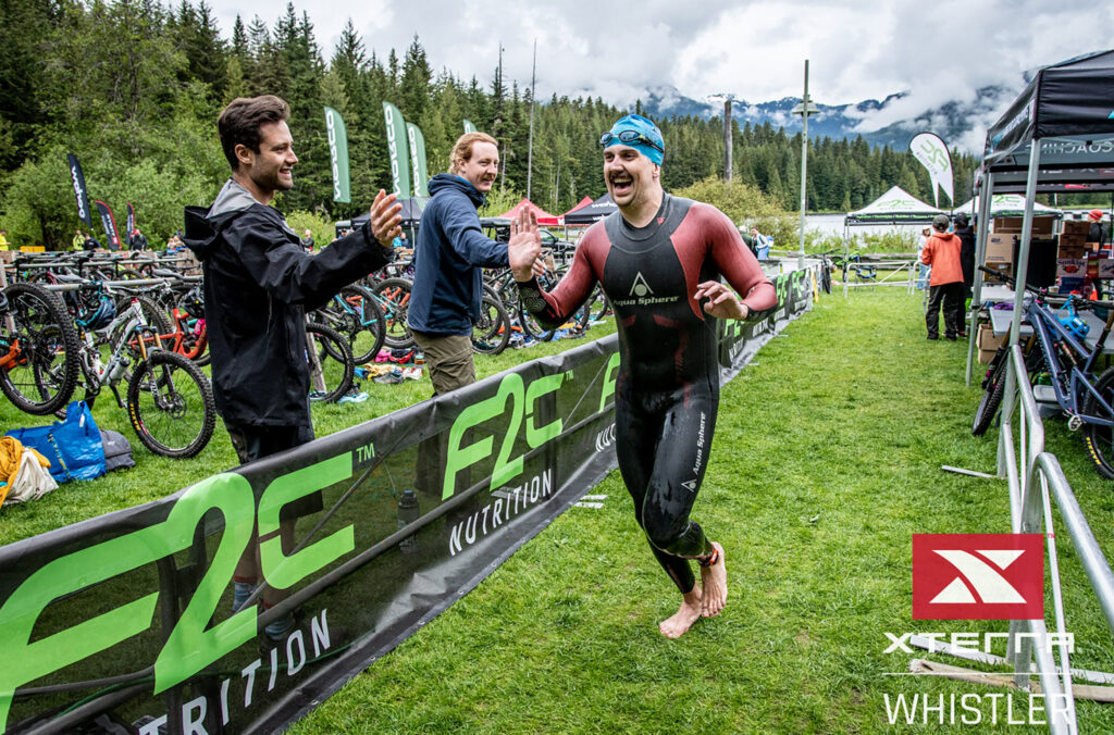 A swimmer fresh out of the lake makes his way to the bike transition in XTERRA Whistler.