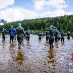 Swimmers wade into the waters of Lost Lake for the start of the Whistler XTERRA.