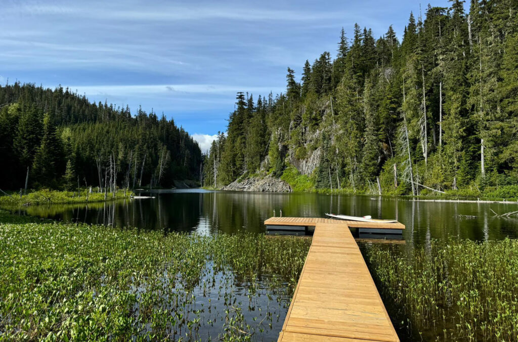 Whistler ATV's backcountry cabin's lakeside location in the summer sun.