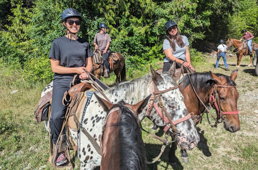 People on horseback.