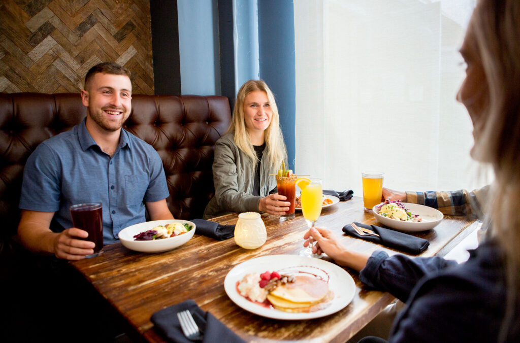 A group of friends tuck into brunch at the Whistler Village Beer Festival. 