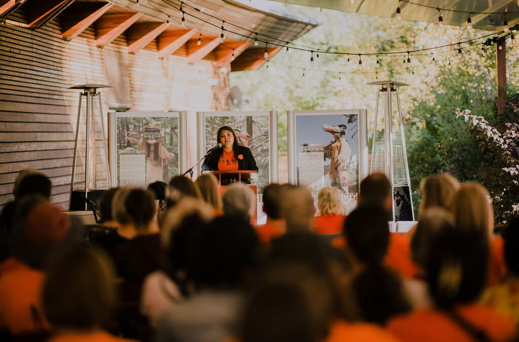 Georgina Dan speaks in front of a large crowd during National Truth and Reconciliation Day at the SLCC.