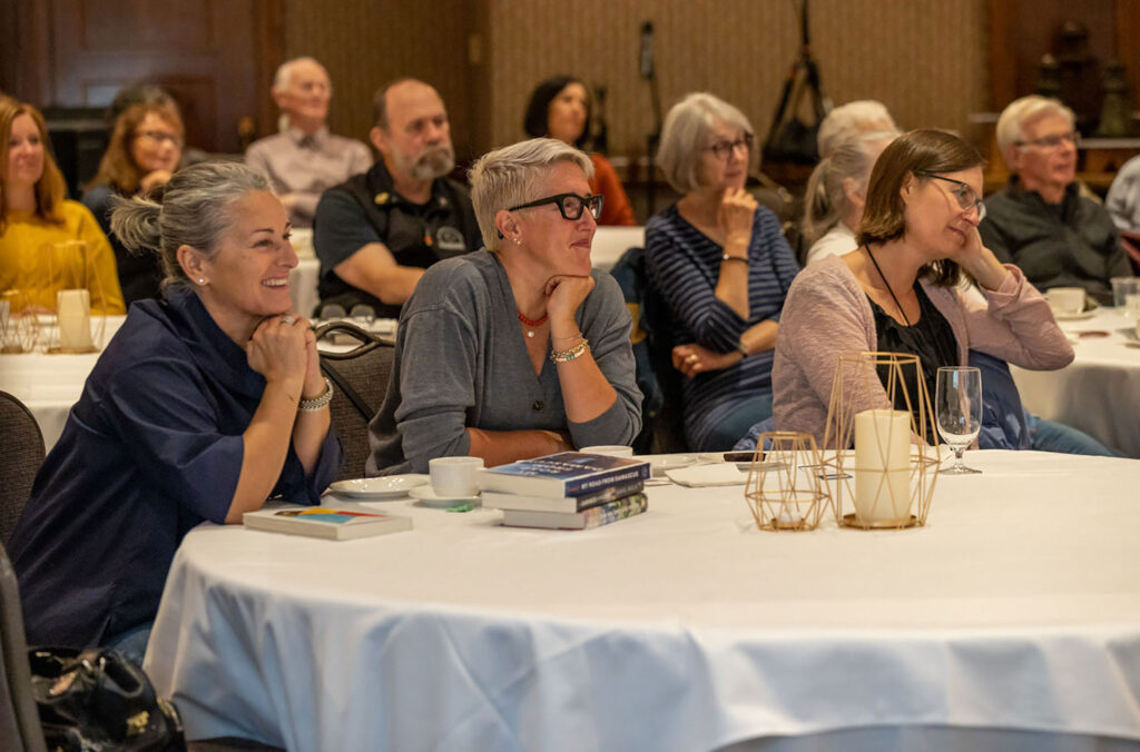 Even goers sit around a table as they listen at a reading event during the Whistler Writers Festival.