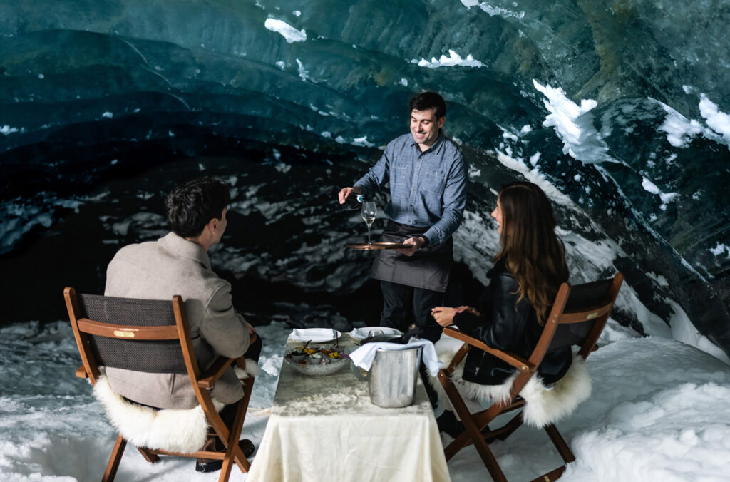 A couple enjoy a unique dining experience in an ice cave close to Whistler.