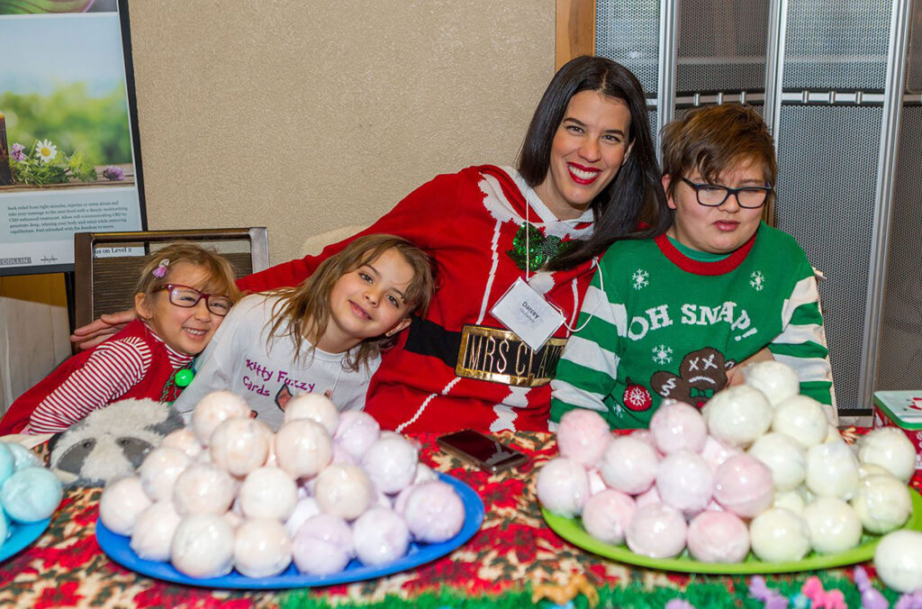 Three young entrepreneurs sell bath fizzes at Bratz Biz in Whistler.