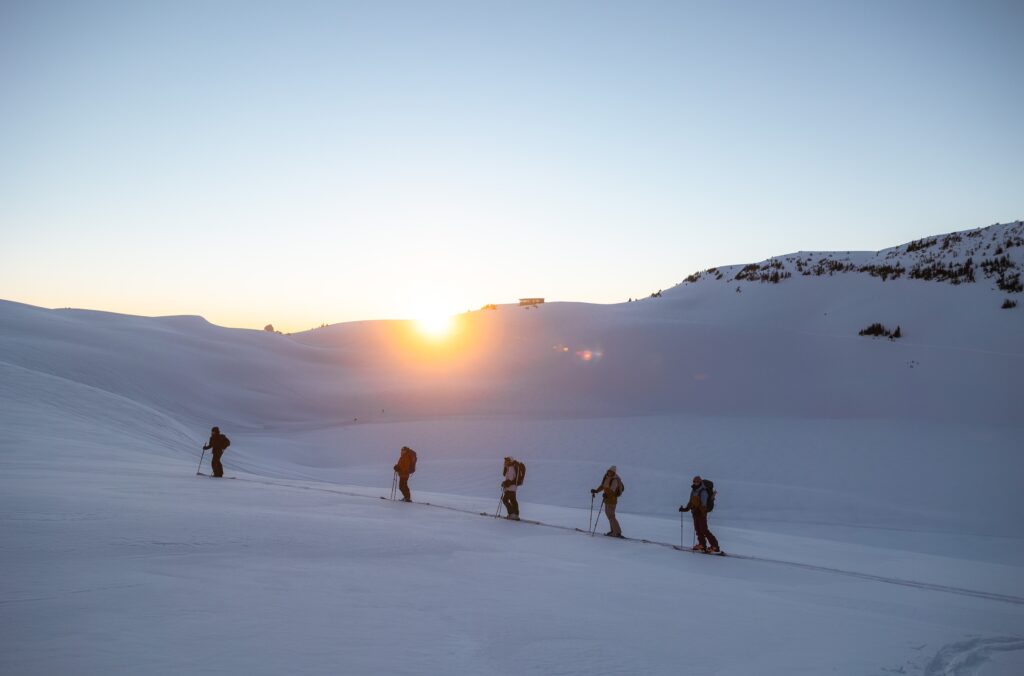 A group of people backcountry skiing