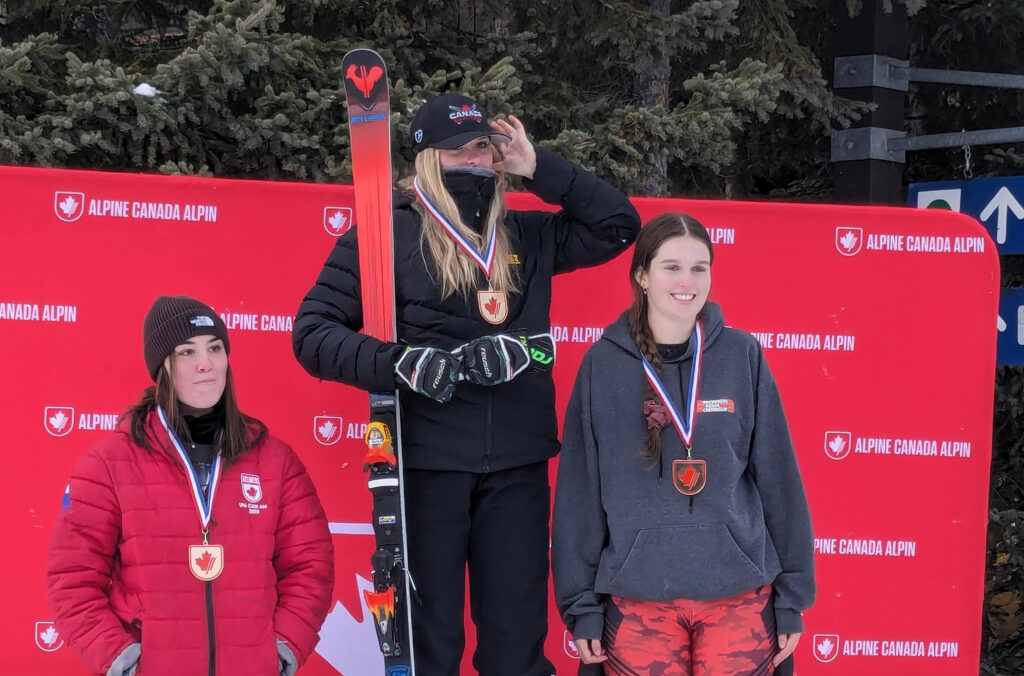 A photo of ski-cross athlete Anne-Marie Joncas standing on the podium in second place.