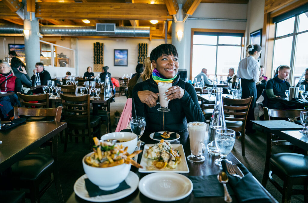 A woman enjoys lunch at Christine's on Blackcomb Mountain in Whistler.
