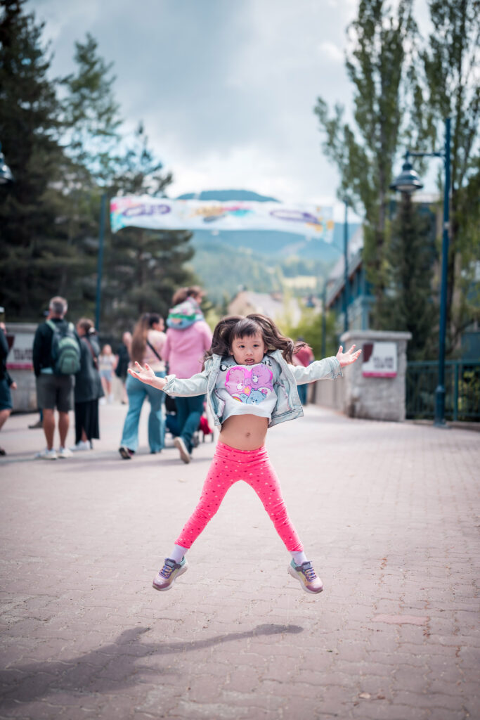 A five-year-old girl jumps for joy at the Whistler Children's Festival.