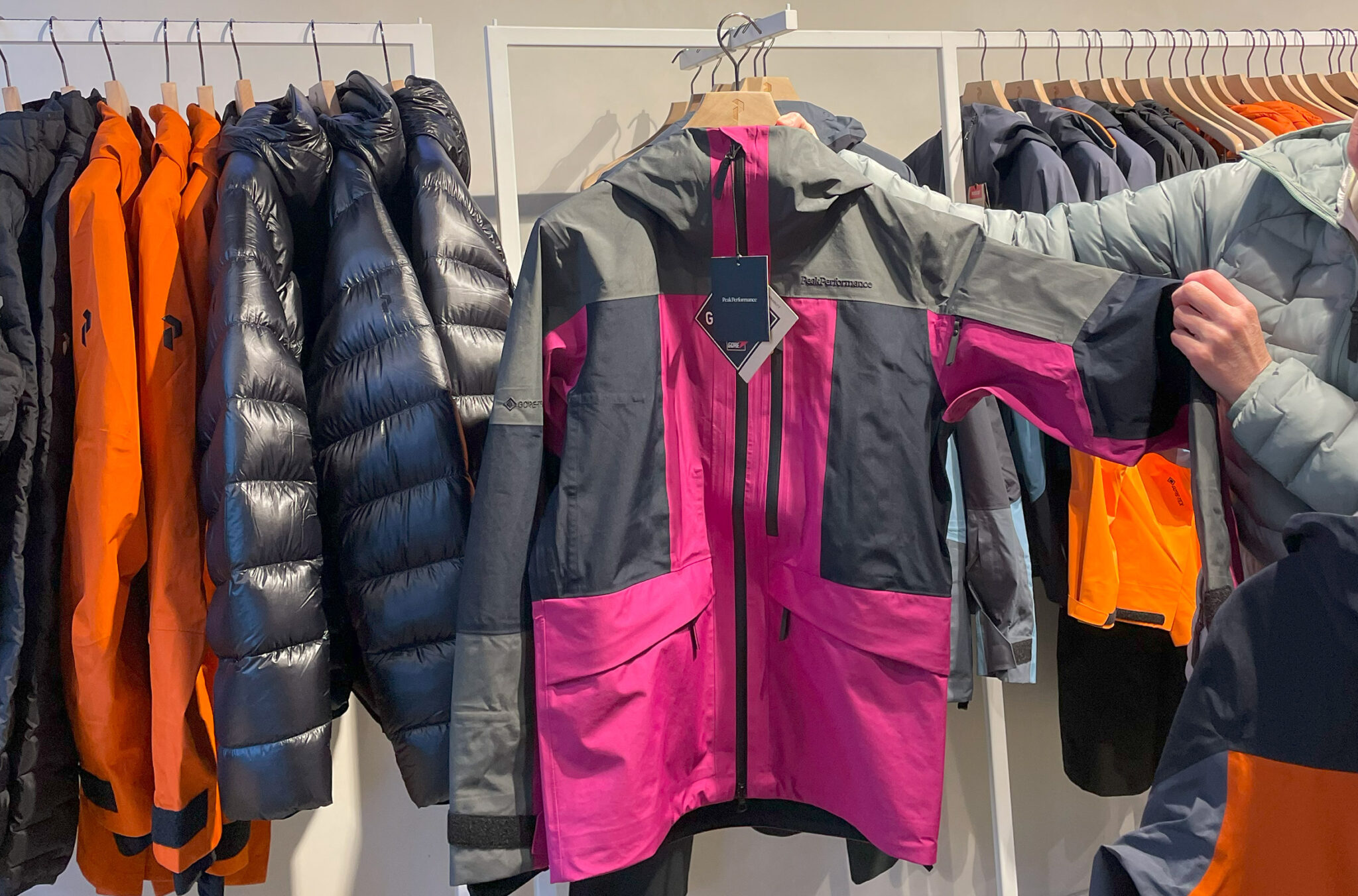 A rack of Peak Performance outdoor jackets.