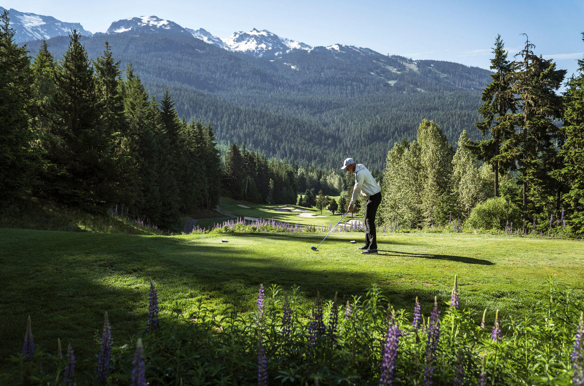 A golfer tackles the Fairmont Chateau Golf Club course in Whistler.