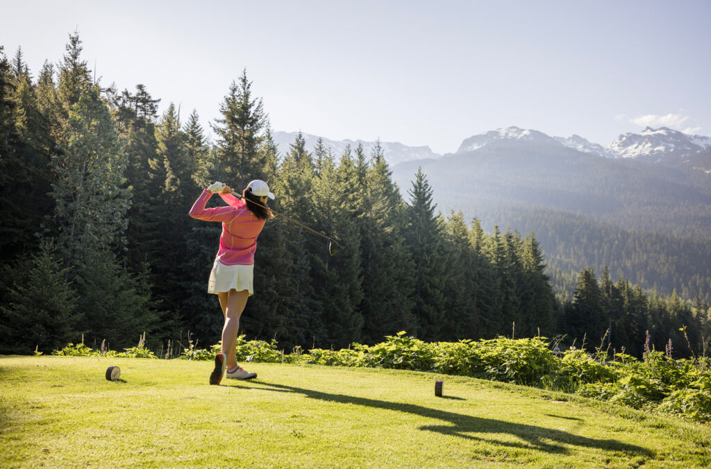 A golfer enjoys the mountainous course at the Fairmont Chateau Whistler Golf Club.