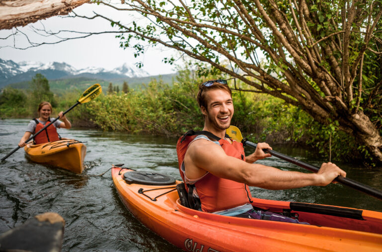 Two kayakers head down the River of Golden Dreams.