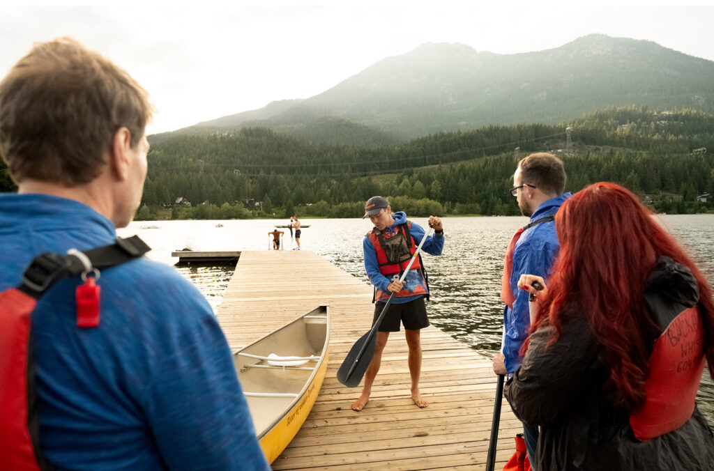 Spencer shows Backroads guests some paddle strokes before they begin their trip.